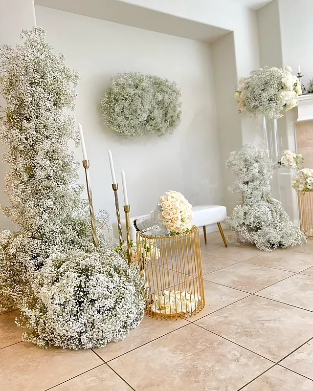 Sculptural baby's breath floral installation with gold stands